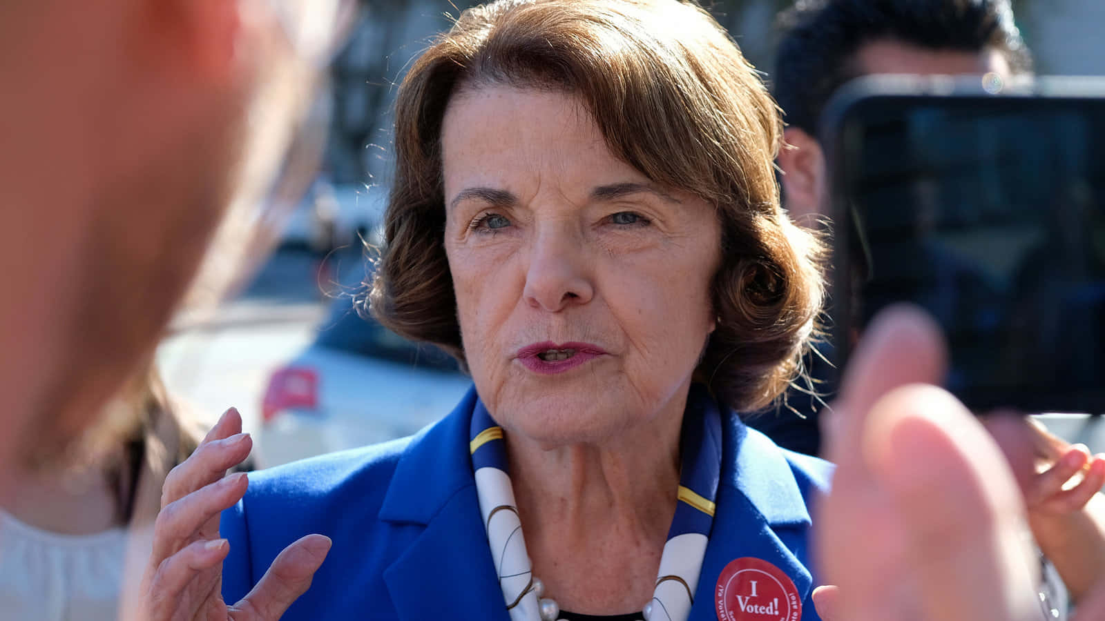 Dianne Feinstein Intered By The Media Wallpaper