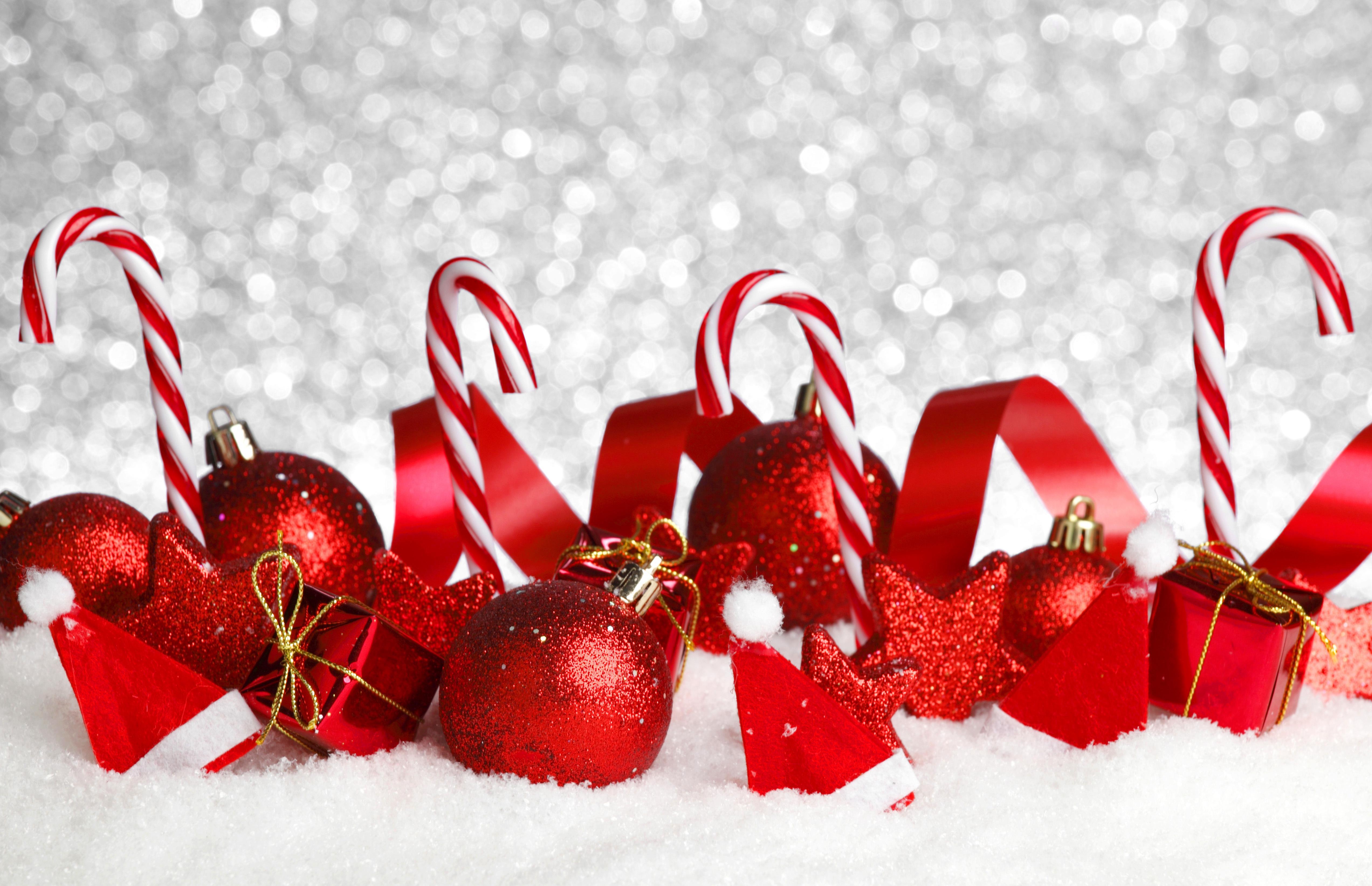 Festive Christmas Scene with Ornaments, Candy Canes, and Snow