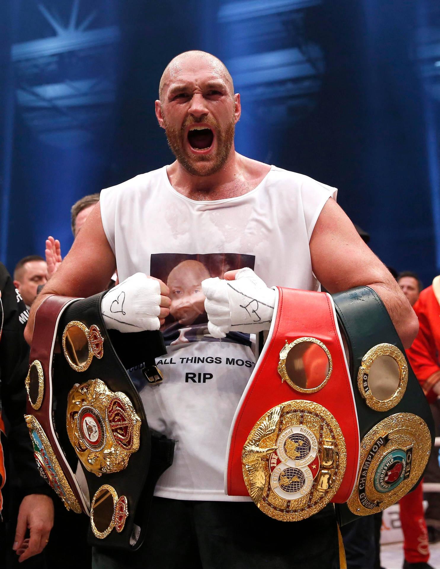 Tyson Fury Screaming With Boxing Belts Wallpaper