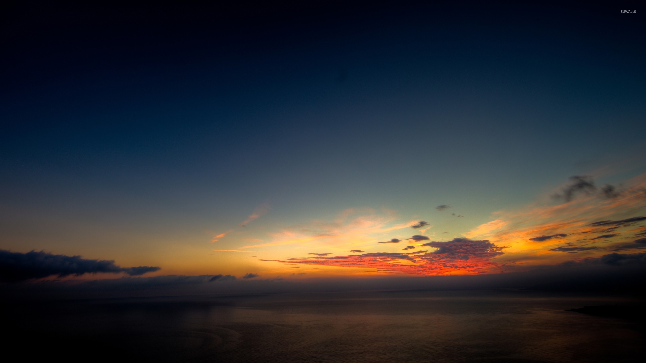 Serene Sunset Above The Ocean Wallpaper Beach