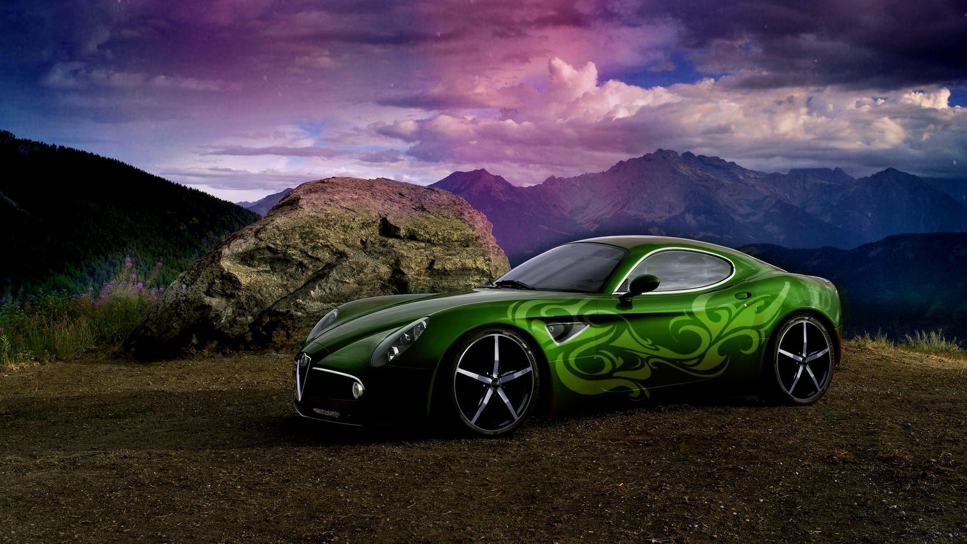 A vibrant green sports car parked on a mountain overlook with a stunning view of the valley and mountains in the background