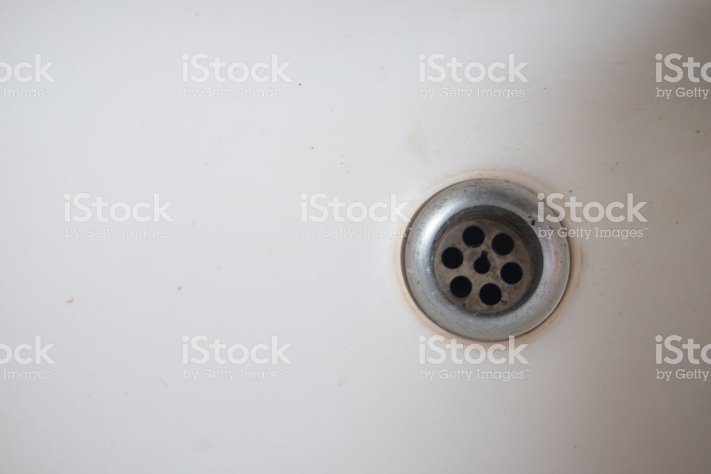 Closeup Of Stainless Steel Drain White Washbasin Background