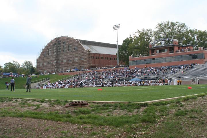Action At The Butler Bowl With Hinkle Fieldhouse In Background