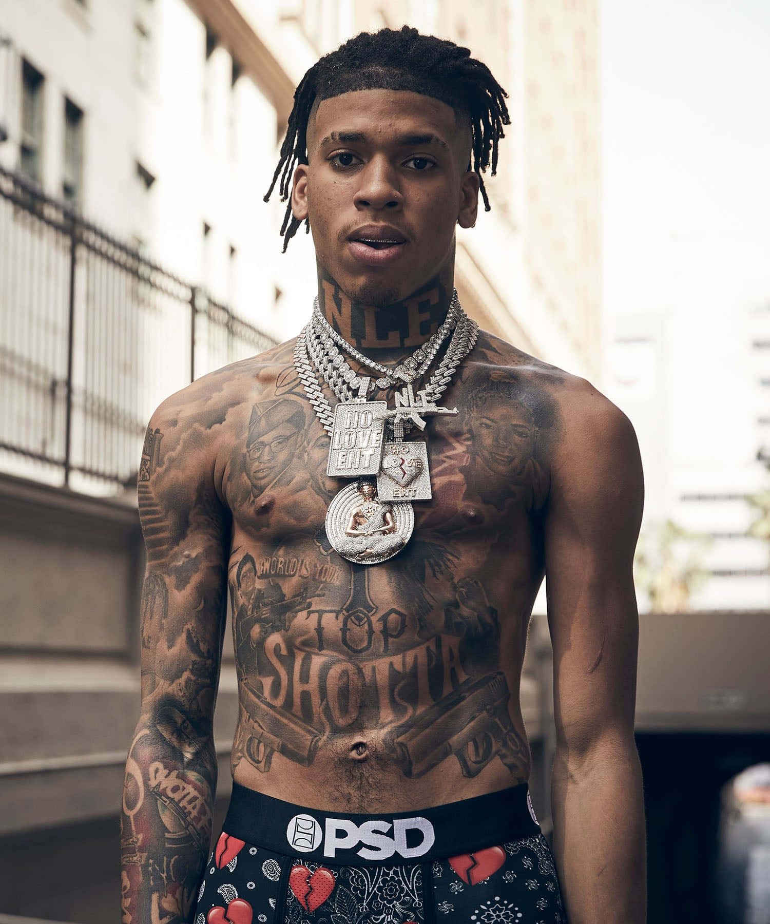 Nle Choppa Posing For A Portrait In Casual Outfit Wallpaper