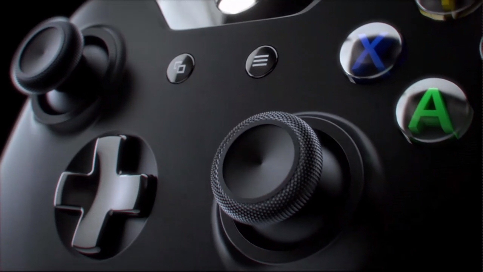 Close-up of an Xbox controller, highlighting its textured thumbstick, directional pad, and face buttons