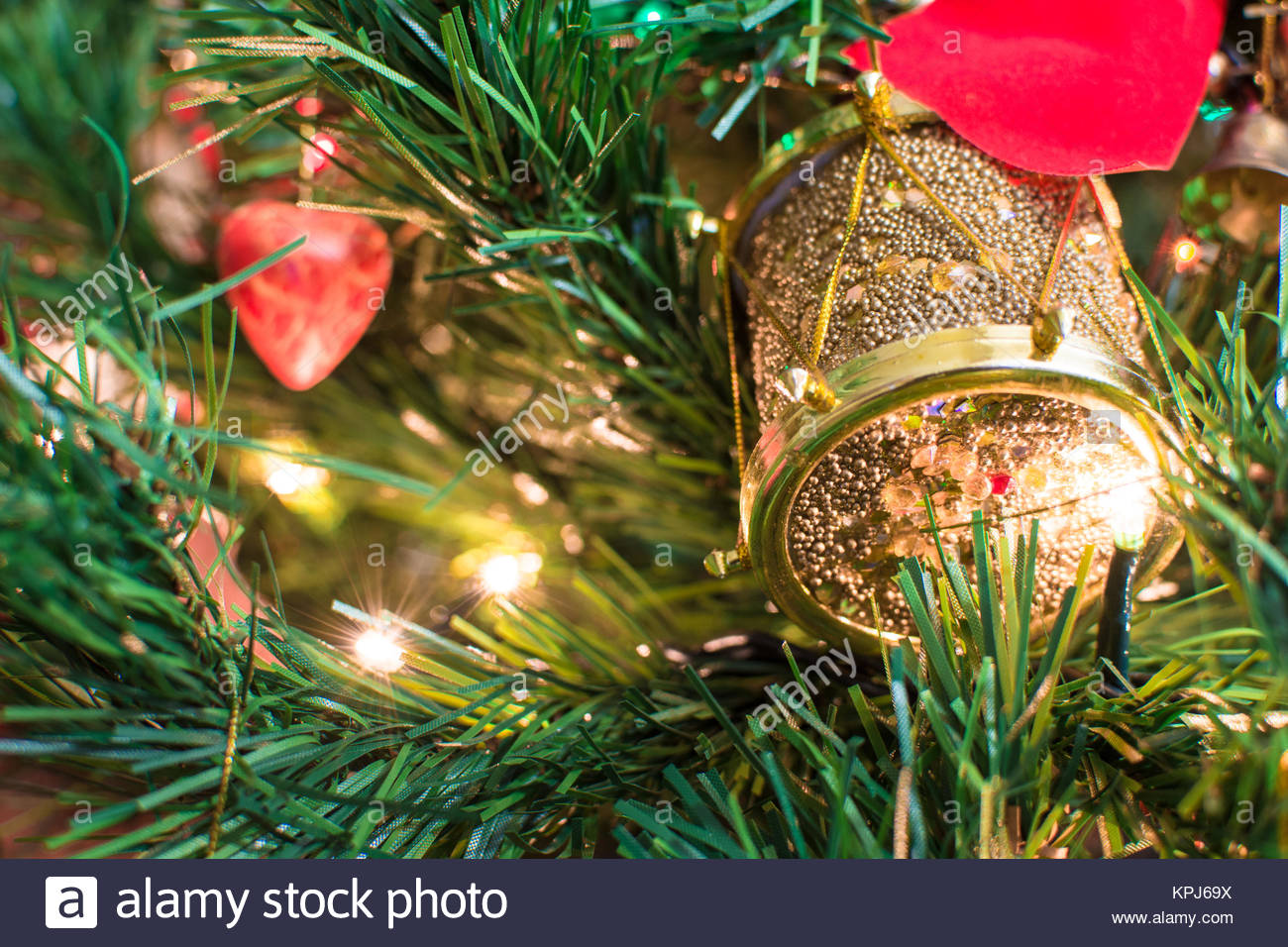 Jingle Bell Christmas Tree Branches With Blurred Background Stock