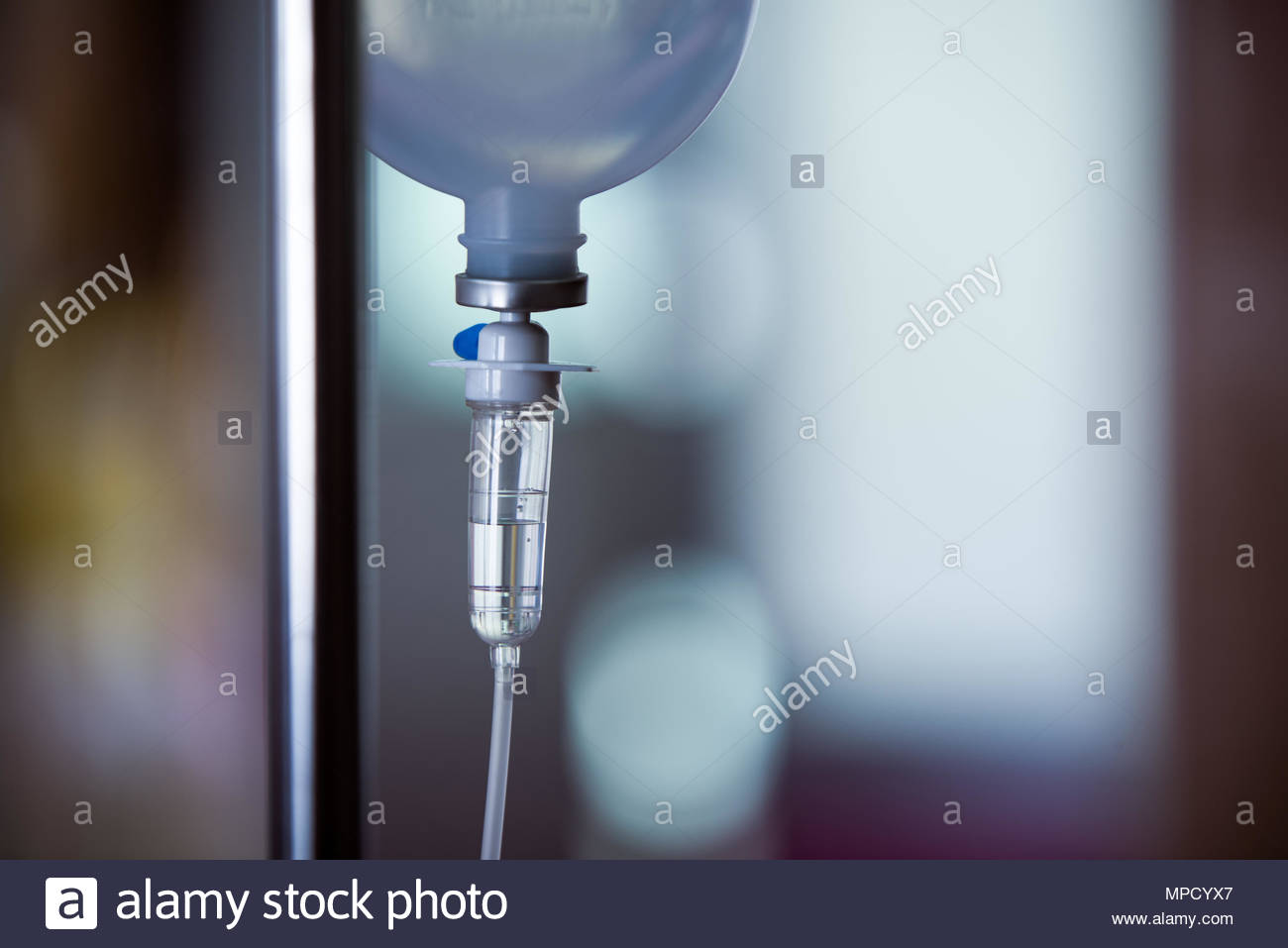 Infusion Normal Saline On Blurred Background Stock Photo