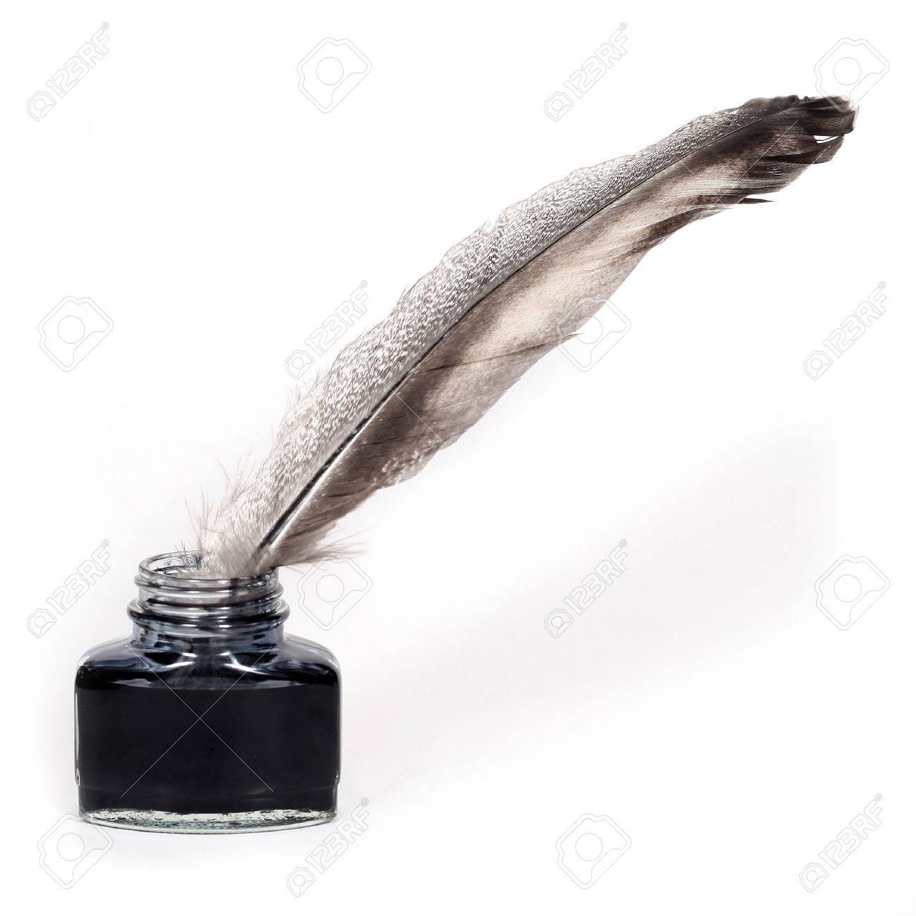 Feather Quill And Inkwell Over White Background Stock Photo