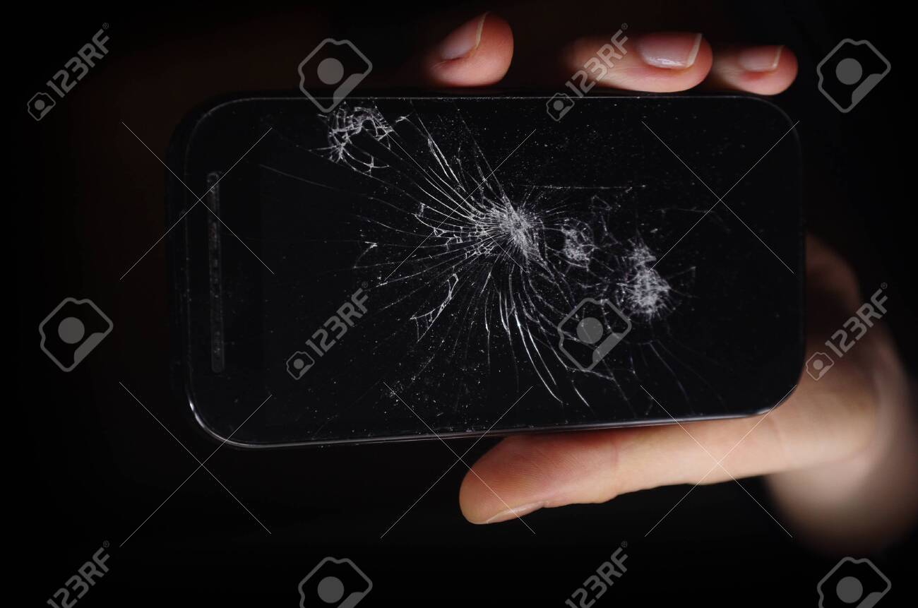 Broken Phone In Hand On Dark Background Crash Phone Fractured