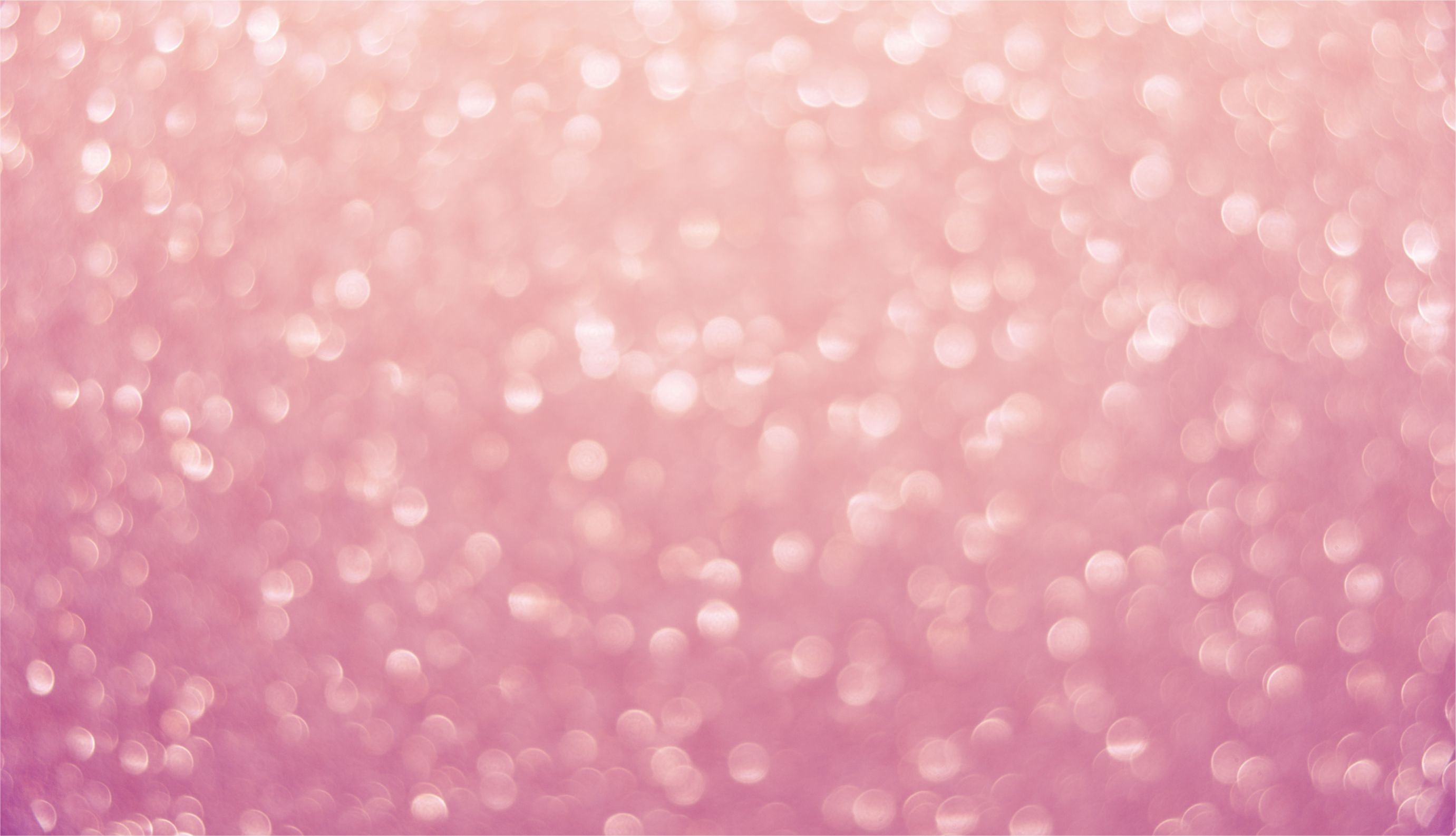 Abstract pink glitter background with bokeh effect, perfect for a feminine and sparkly wallpaper