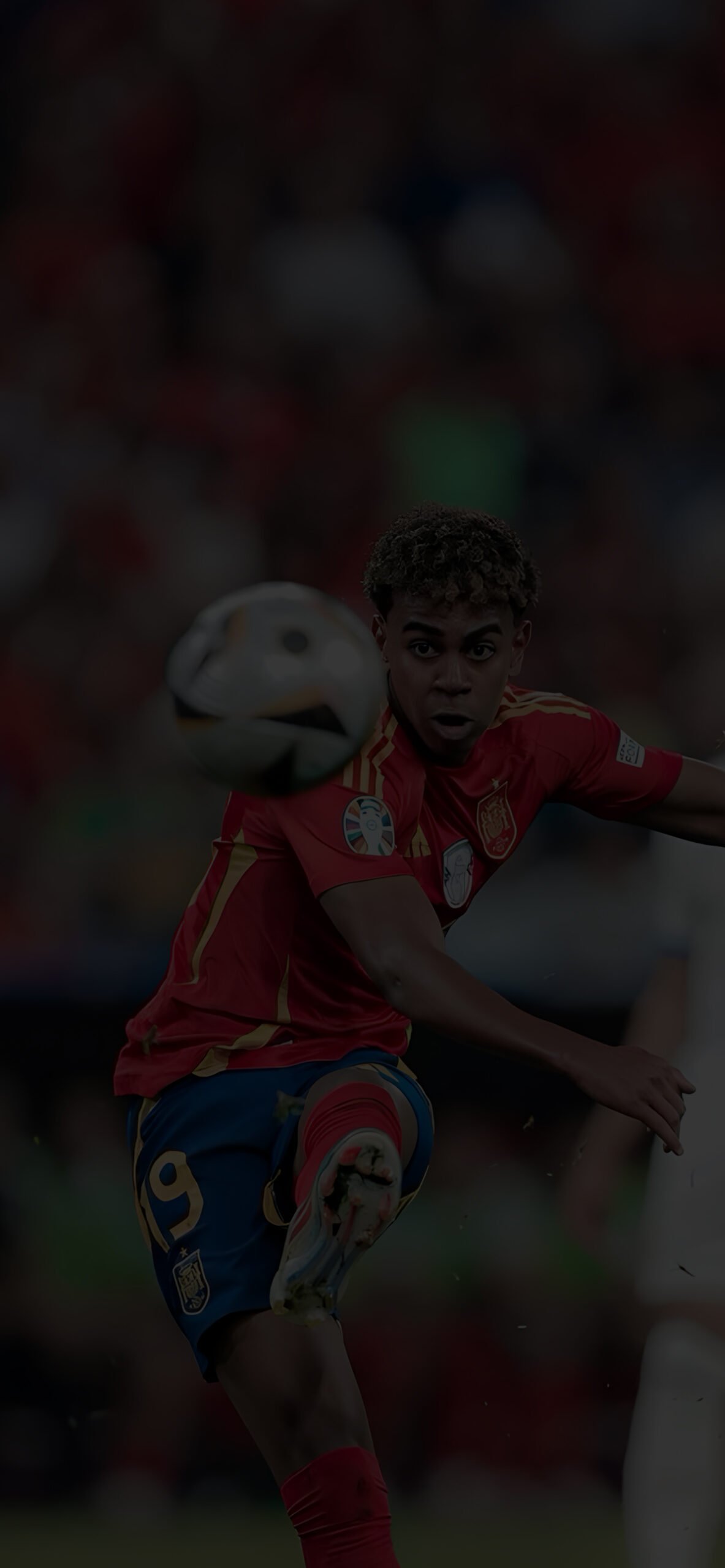 Lamine Yamal of Spain kicks the soccer ball during a match