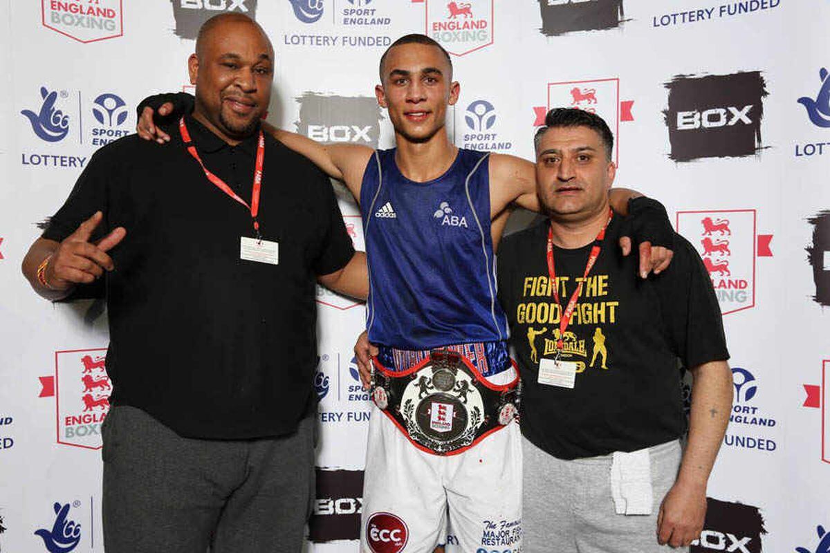 Benjamin Whittaker celebrates his win with his coaches