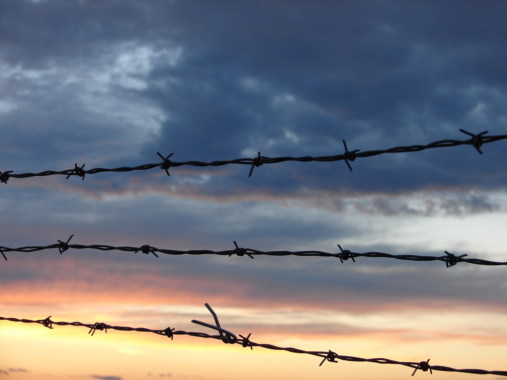 Barbed Wire Sunset Background By Fantasystock