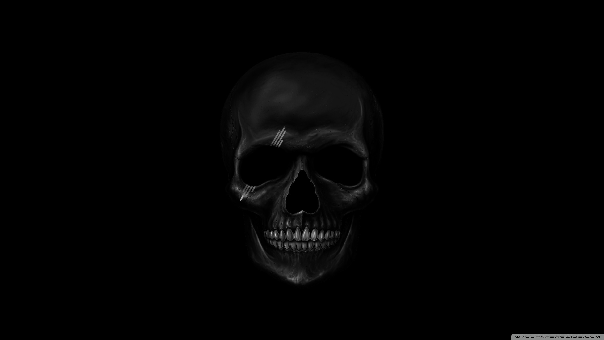 Dark and mysterious black skull wallpaper on a solid black background