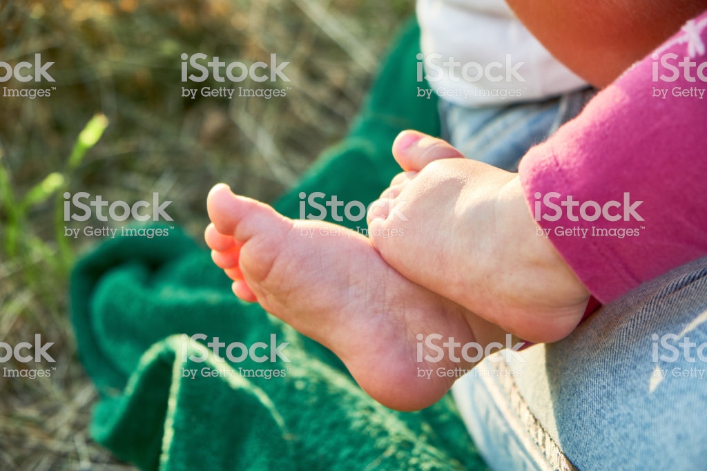 Little Girl Barefoot Closeup Feet On Grass Background Relaxing