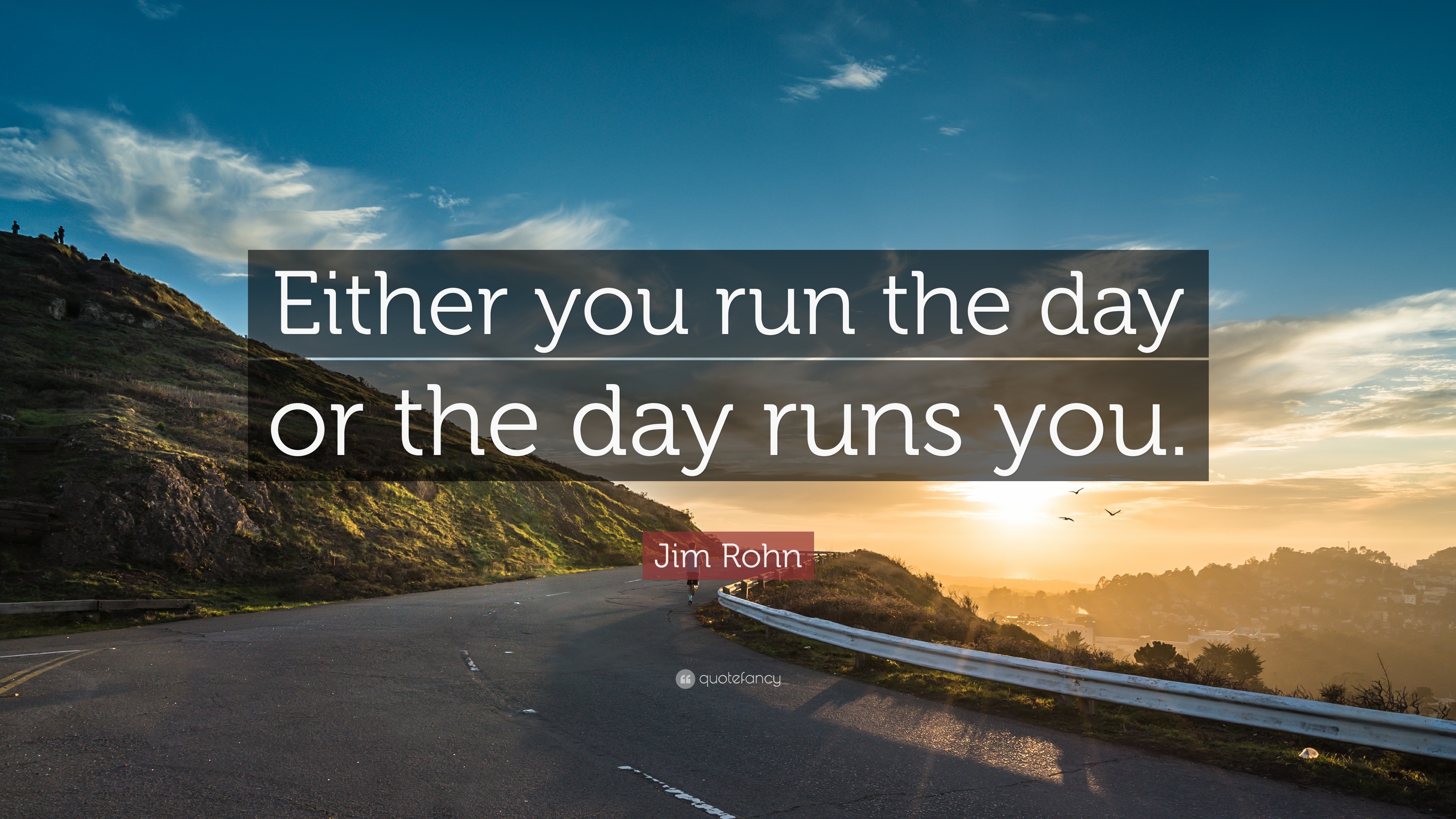 A quote by Jim Rohn about taking control of your day, overlaid on a scenic image of a winding road at sunset
