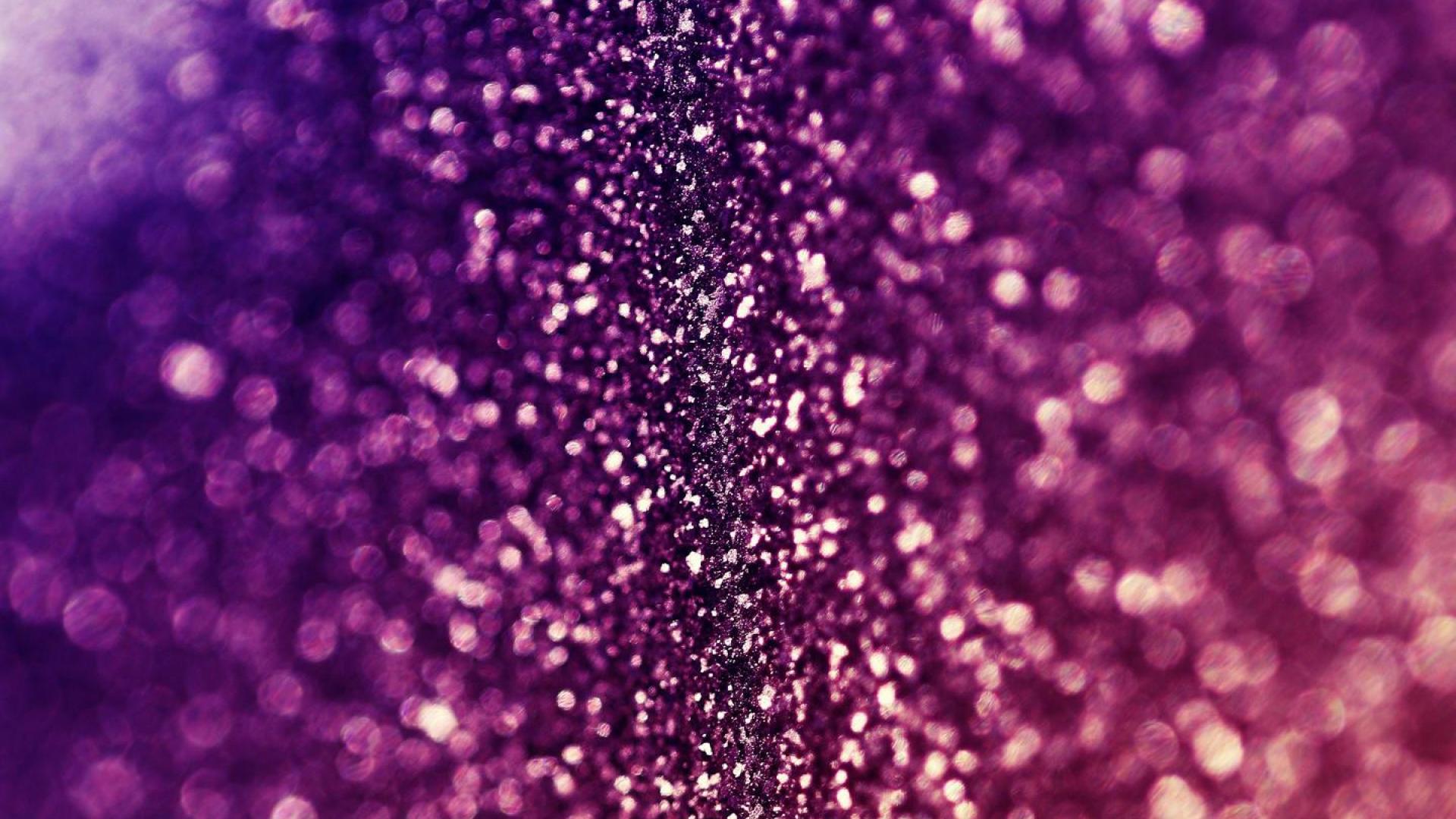 Close-up of sparkling pink glitter with a bokeh effect, creating a vibrant and textured background