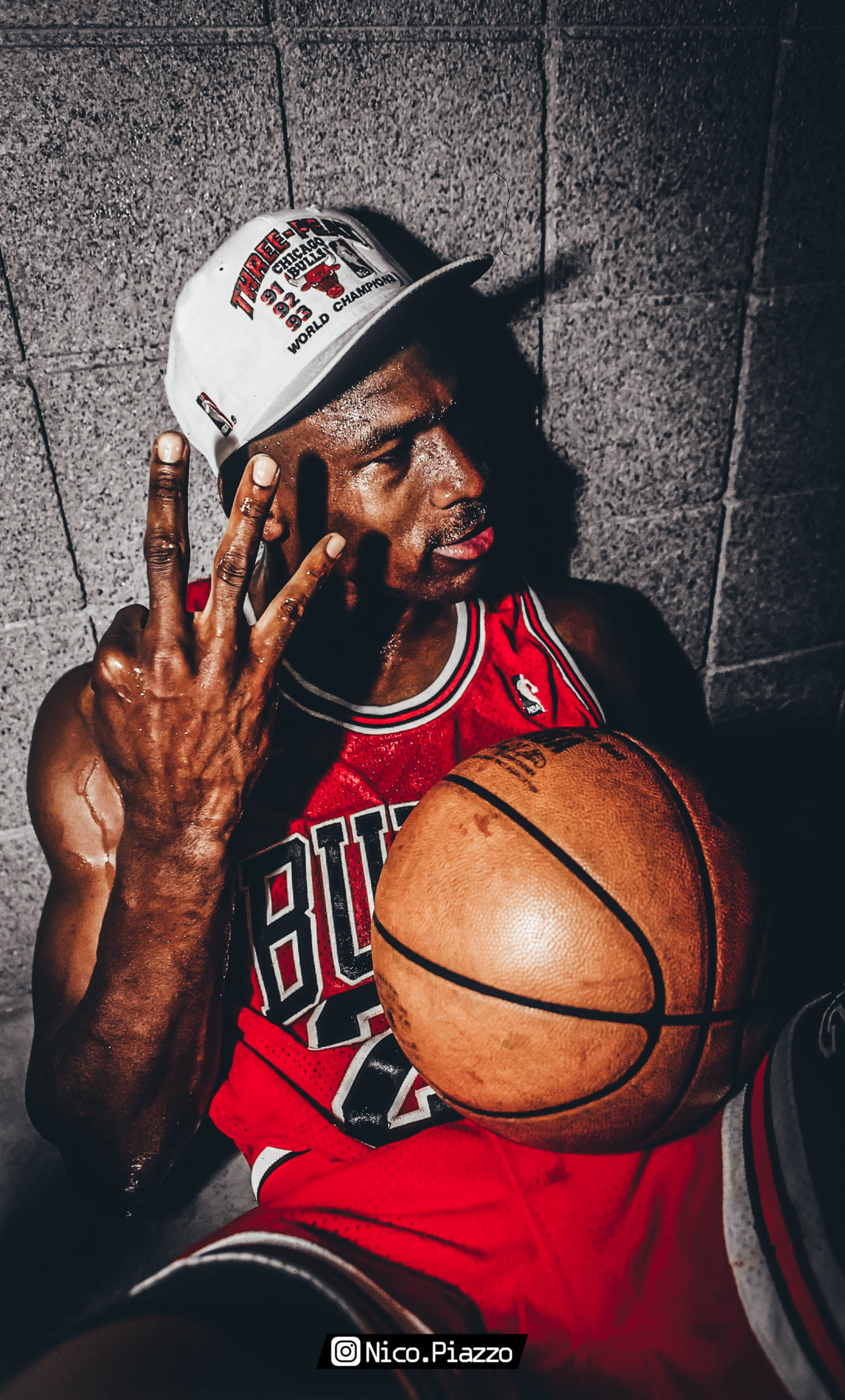Michael Jordan holding a basketball and celebrating his third NBA championship with the Chicago Bulls