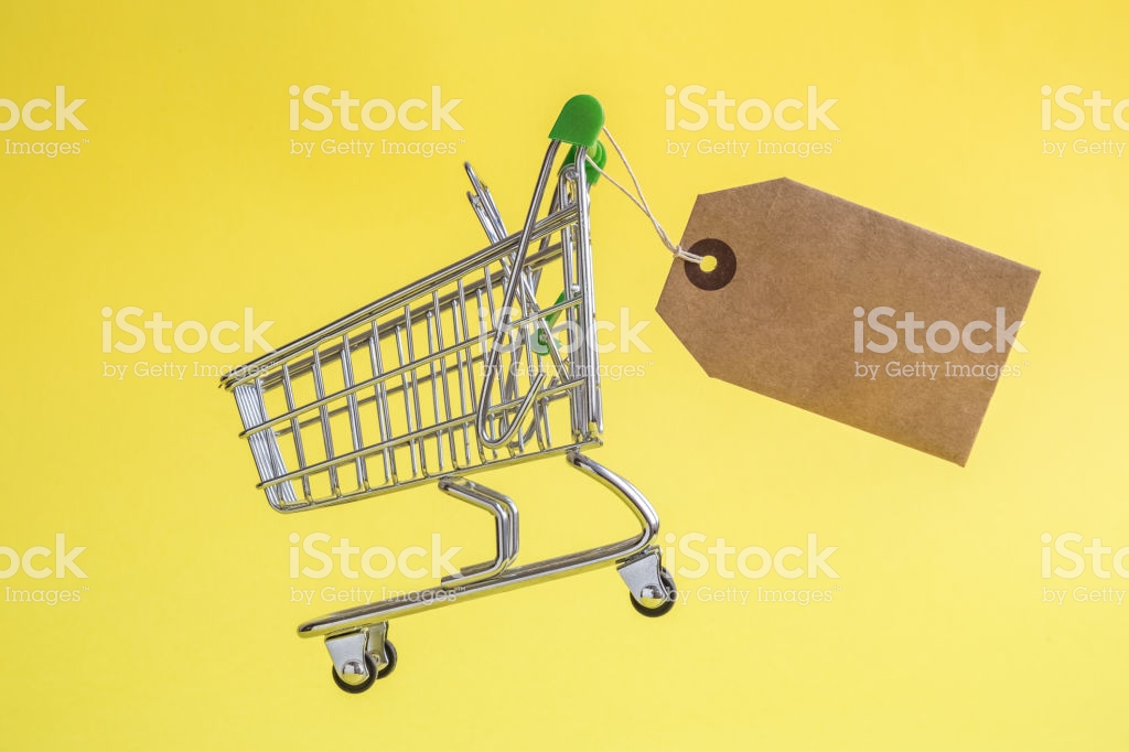 Shopping Trolley Toy With Special Offer Tag On Yellow Background