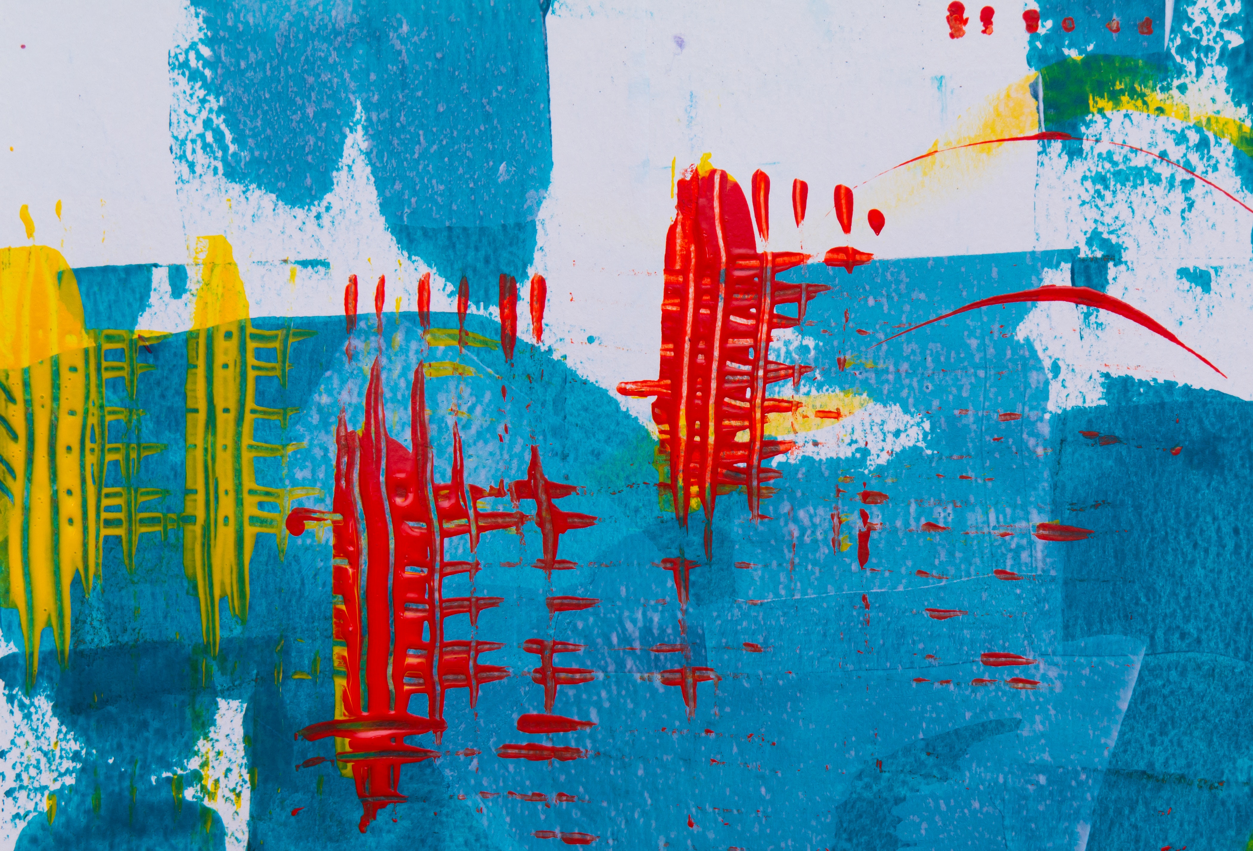 A vibrant abstract art piece featuring bold strokes of blue, red, and yellow paint, creating a dynamic and textured composition