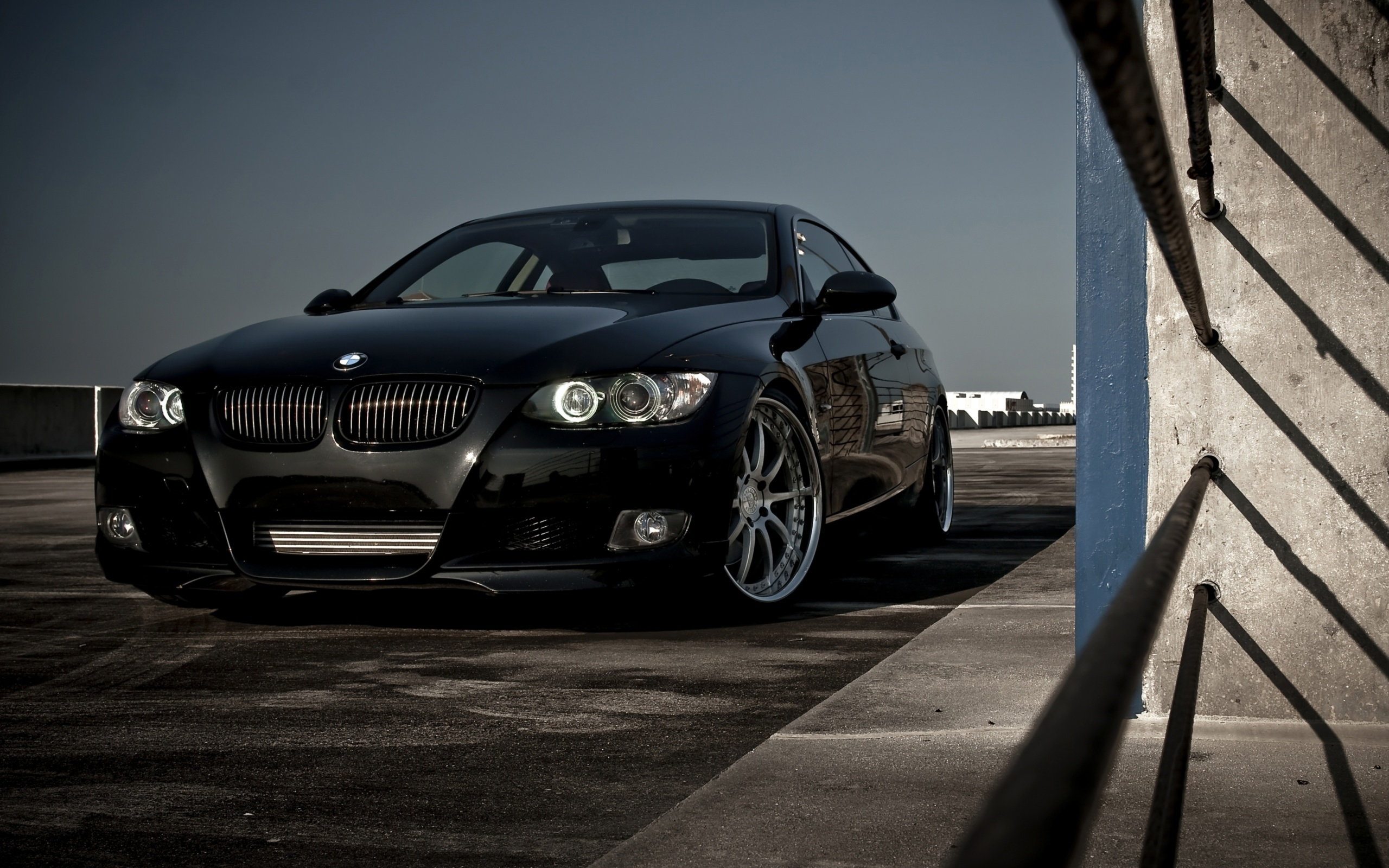 Sleek Black BMW 3 Series Coupe Parked on Rooftop