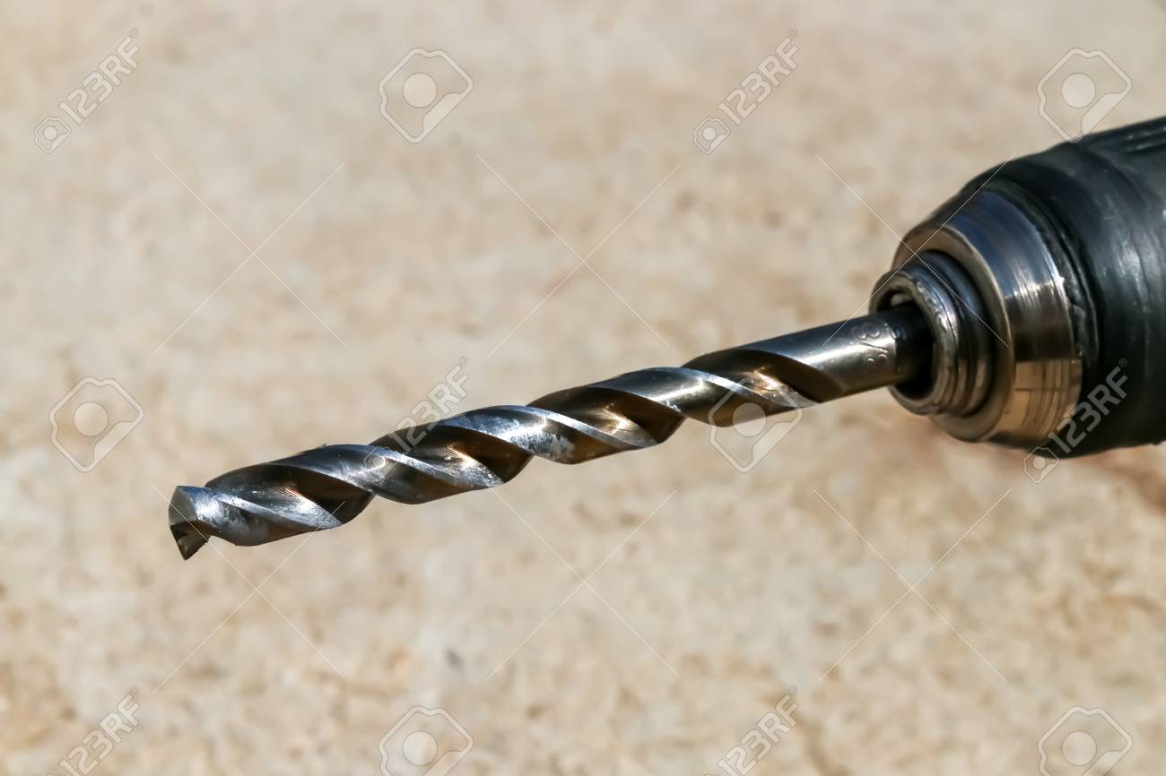 The Isolated Drill Bits With Gray Ground Background Stock