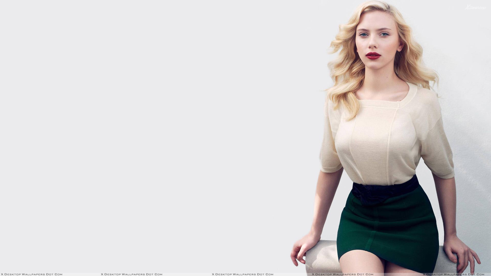 Scarlett Johansson Sitting Pose In White Top N Black Skirt Wallpaper