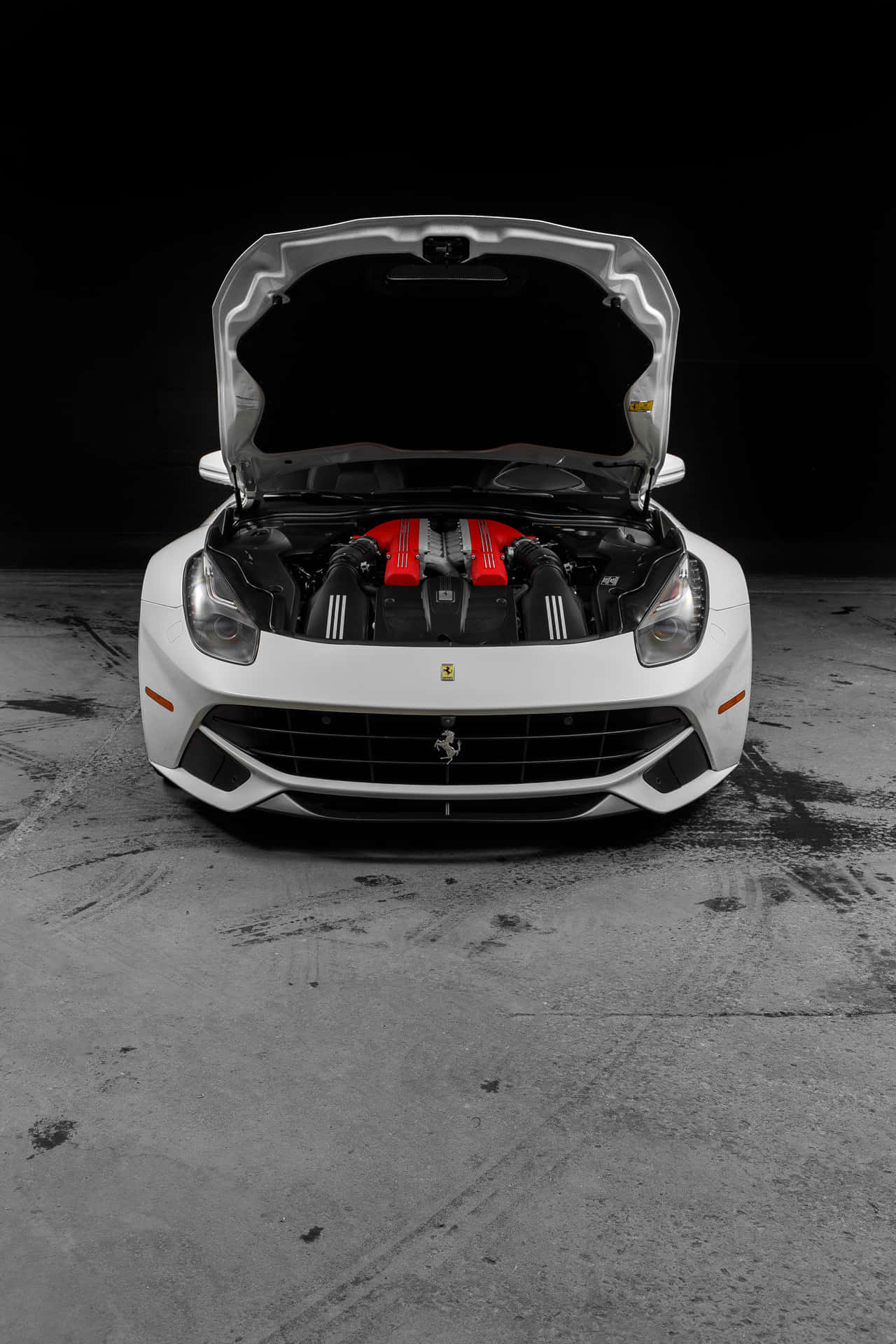 A Sleek White Ferrari Alongside An Immaculate iPhone Wallpaper