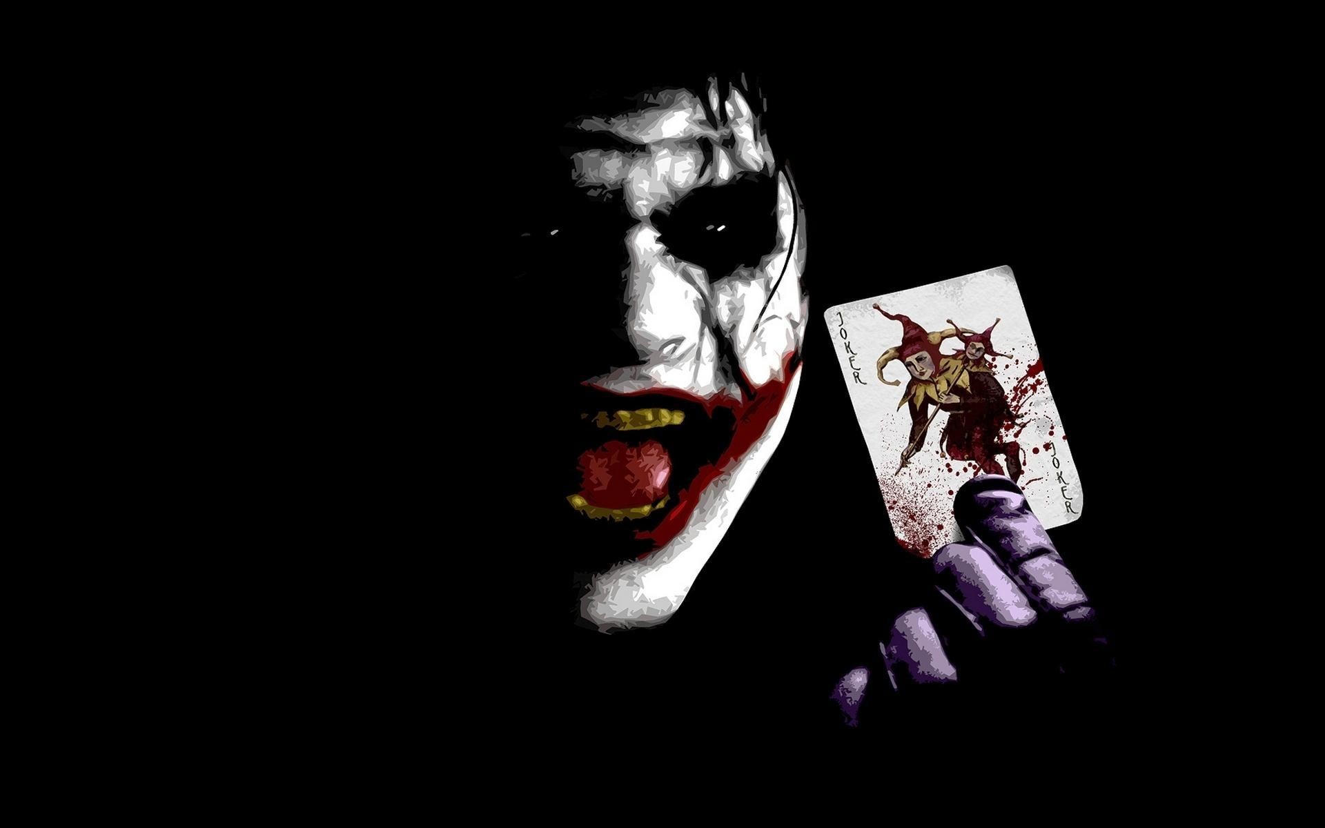 A chilling close-up of the Joker, his face painted and a bloody Joker playing card held in his hand, against a dark background