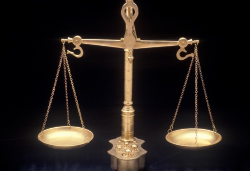 Scales Of Justice Gold With Black Background Stock Photo