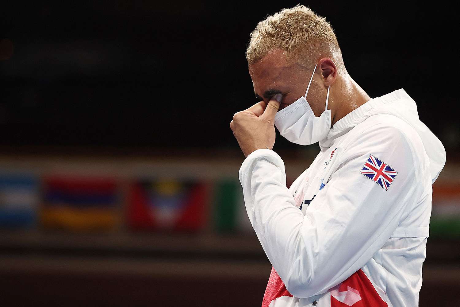 Benjamin Whittaker, British boxer, wearing a mask and his team GB tracksuit