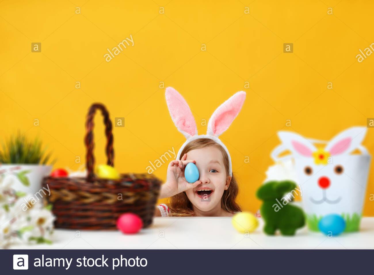 Free download Happy cheerful child peeps from the table and holds an ...