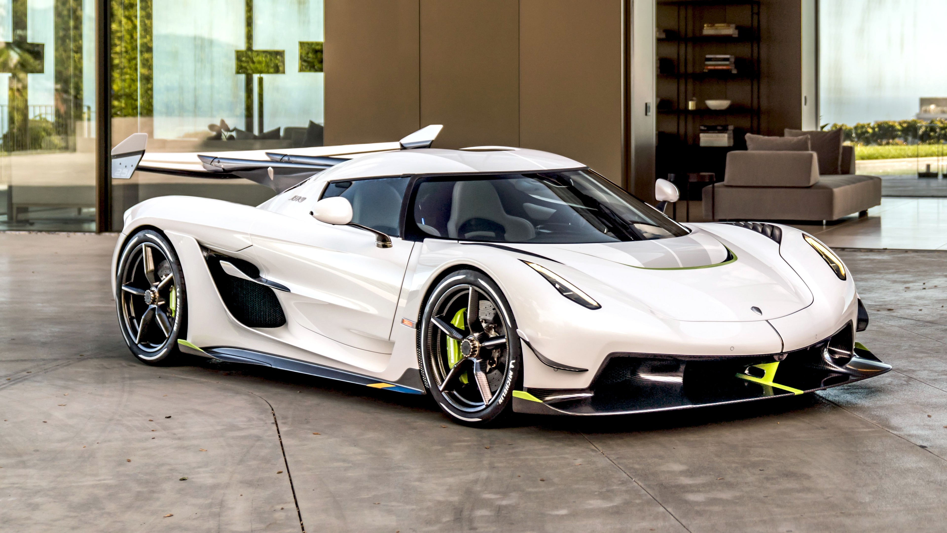 White Koenigsegg Jesko Absolut parked in front of a modern house
