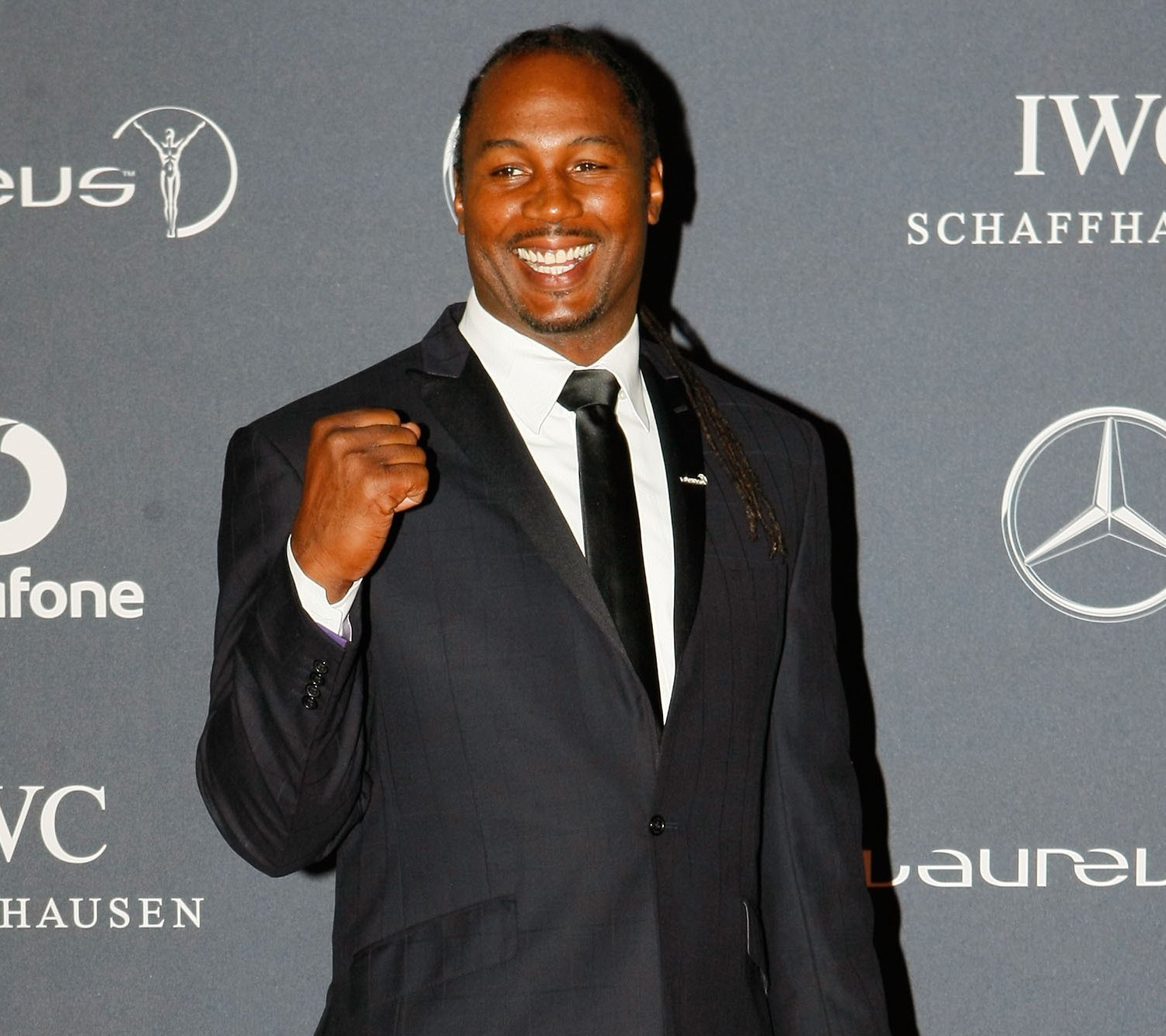 Famous Boxer Lennox Lewis In Black Suit Wallpaper And
