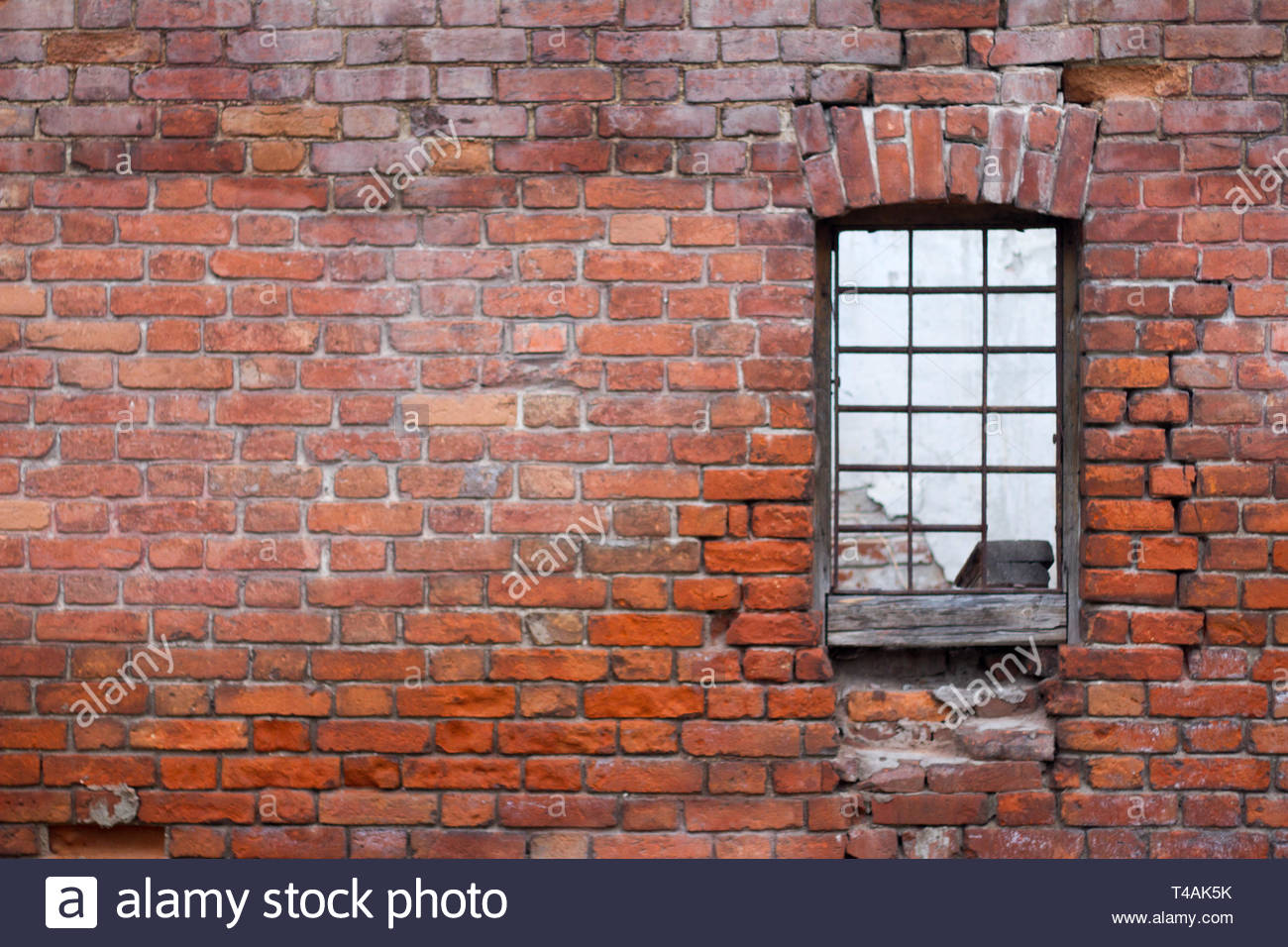 Window With Bars On The Background Of Brick Wall Old