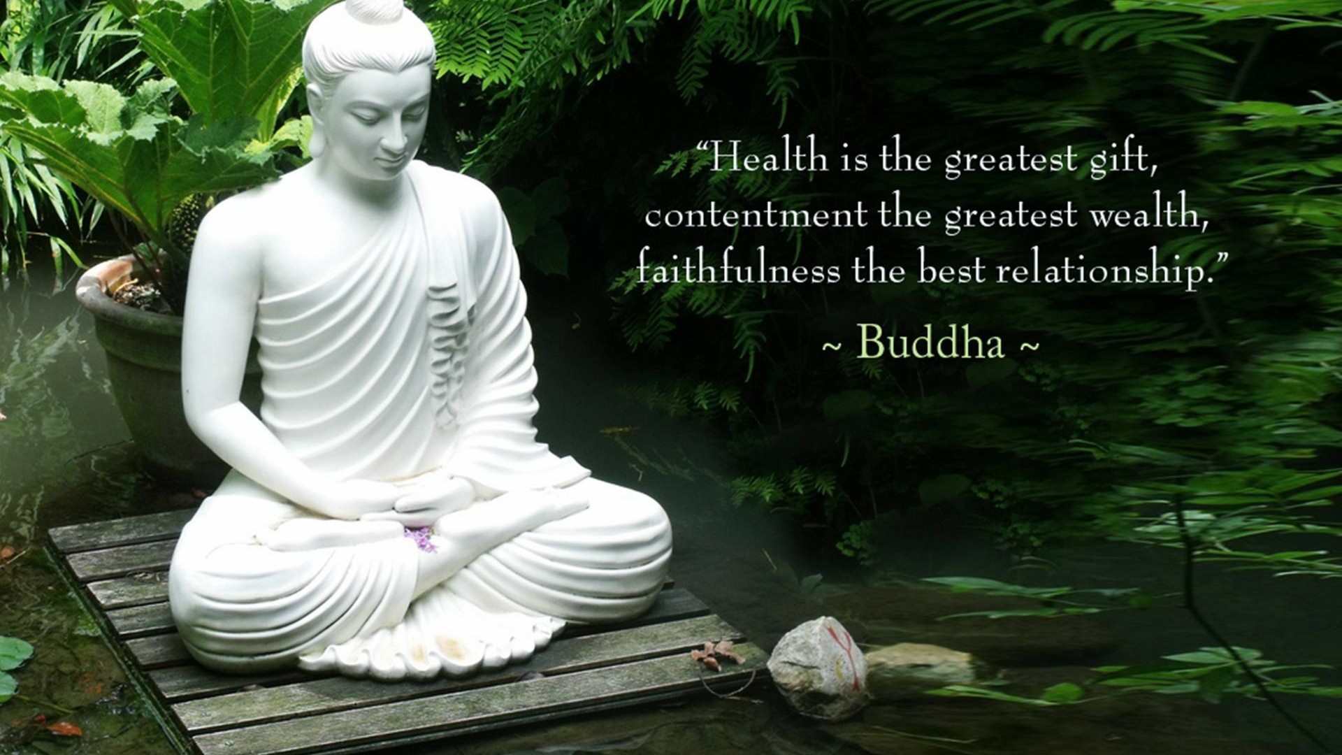 Serene Buddha statue amidst lush greenery with a quote about health, contentment, and faithfulness