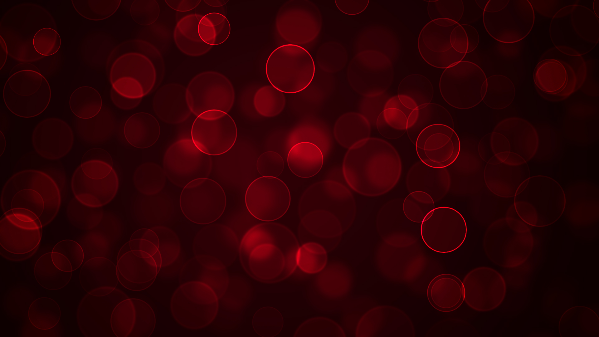 Abstract background with dark red bokeh circles creating a soft, dreamy effect