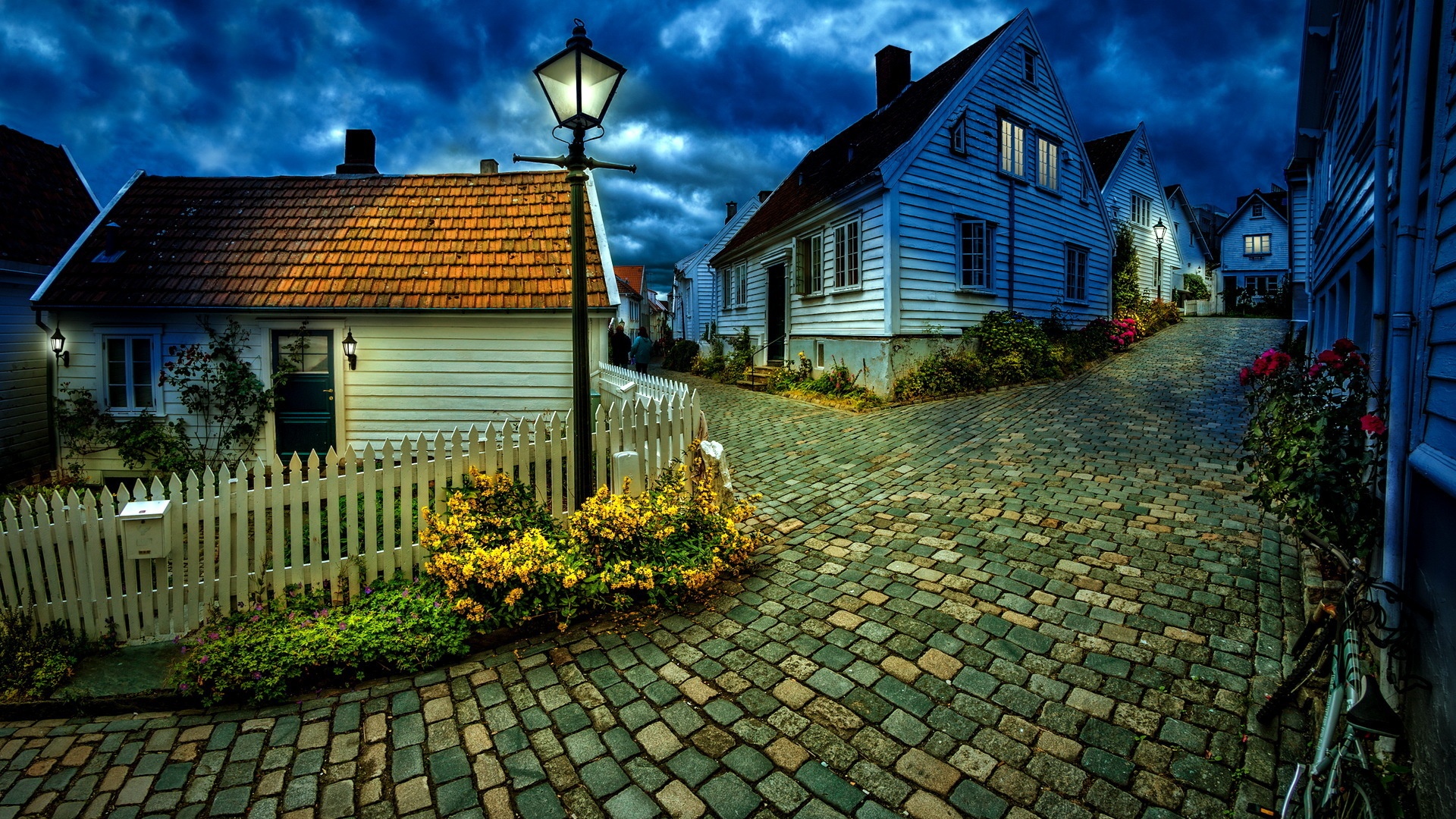 Charming cobblestone street in a historic European village at dusk