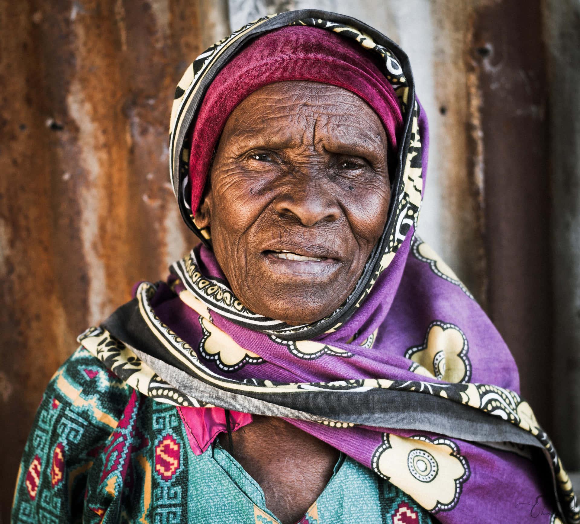 Download Straight Face African Old Lady Wallpaper
