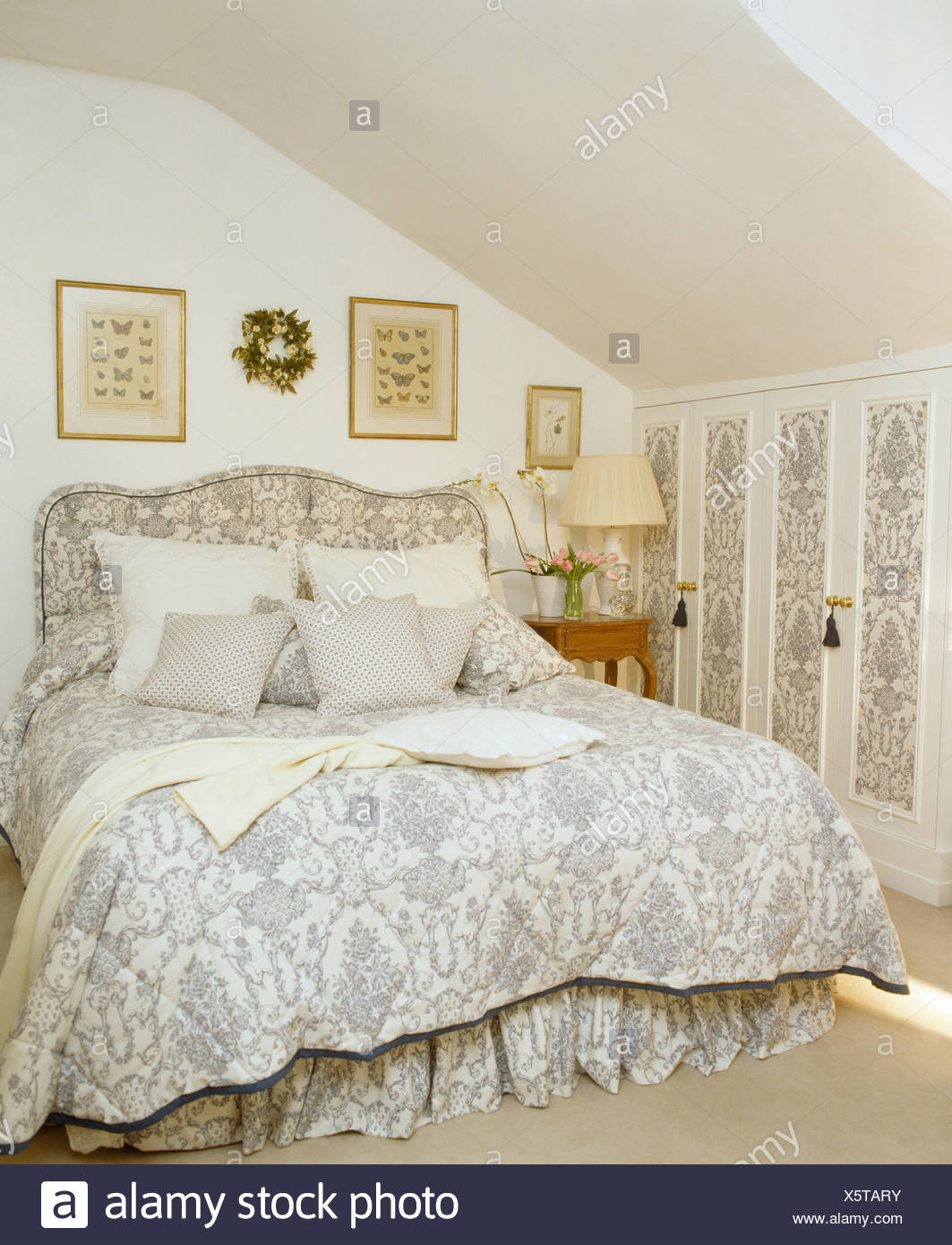 Pale Grey White Quilt And Upholstered Headboard On Bed In Attic