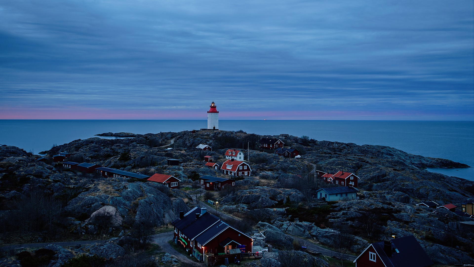 Lighthouse by sea against sky at sunset Landsort ja island 1920x1080