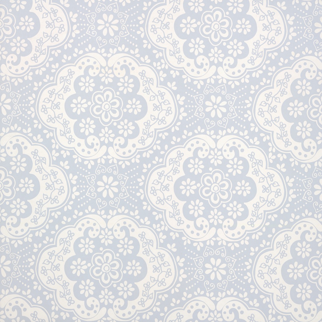 With its bright intricate floral motif Dentelle designer wallpaper