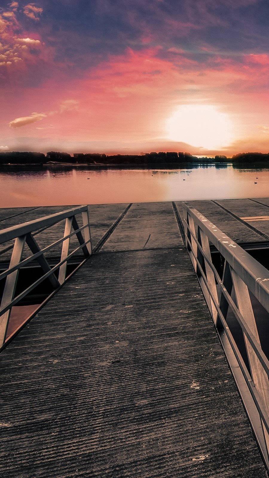 Stunning Sunset On The Lake Dock Wallpaper