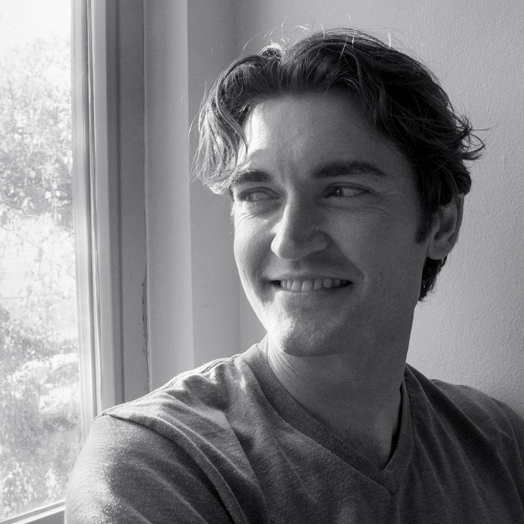Ross Ulbricht looking out the window. Black and white photo