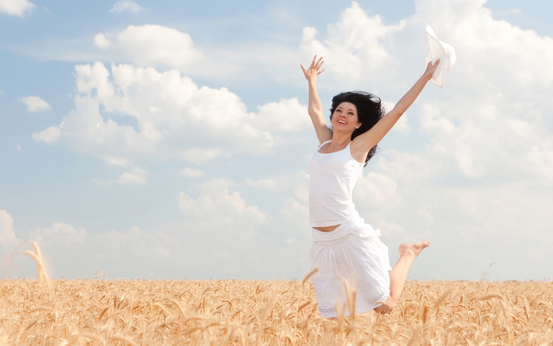 Happy Woman Jumping In Golden Wheat Mystery Wallpaper
