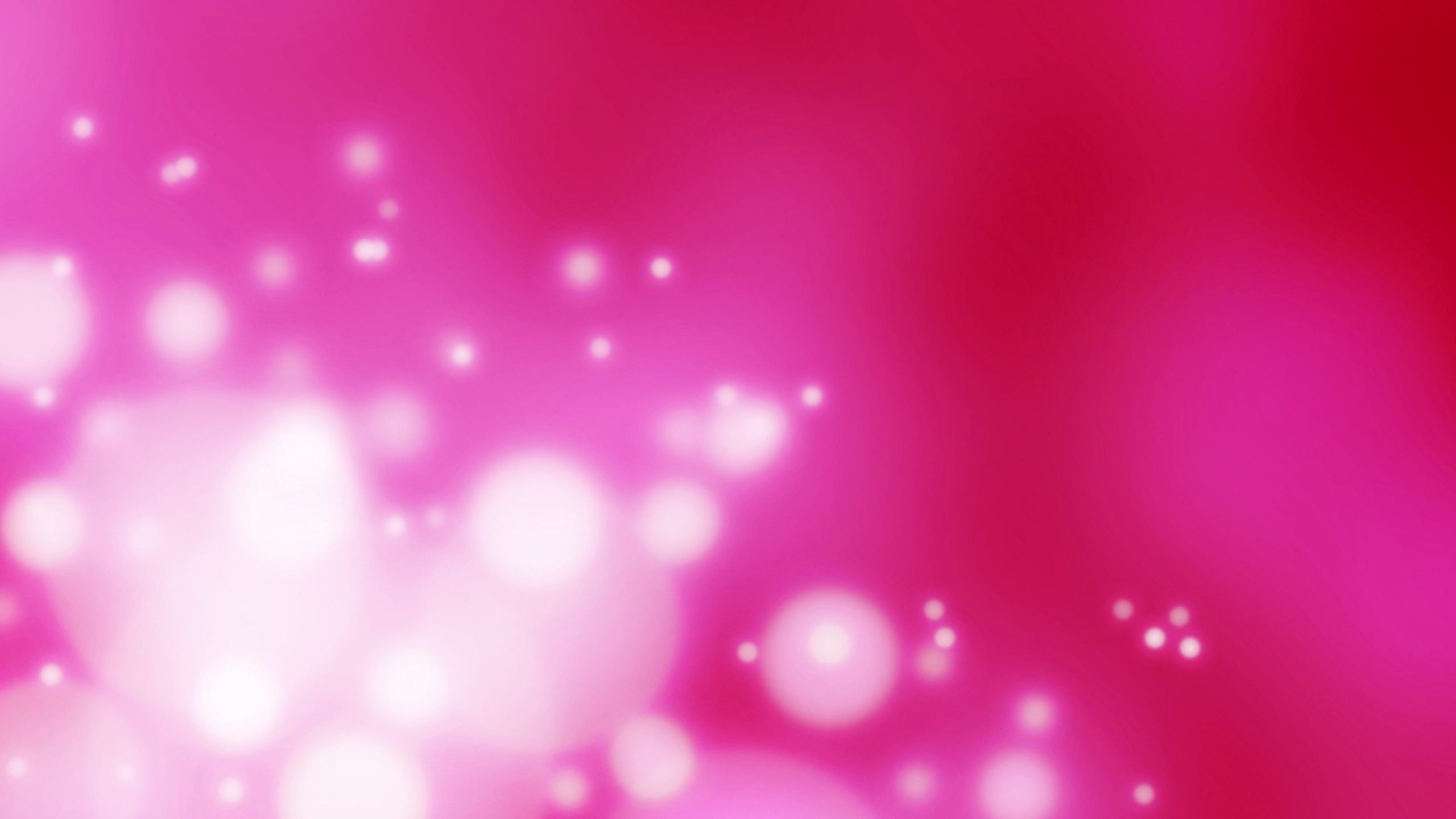 Abstract pink glitter background with bokeh effect, perfect for wallpapers or festive designs