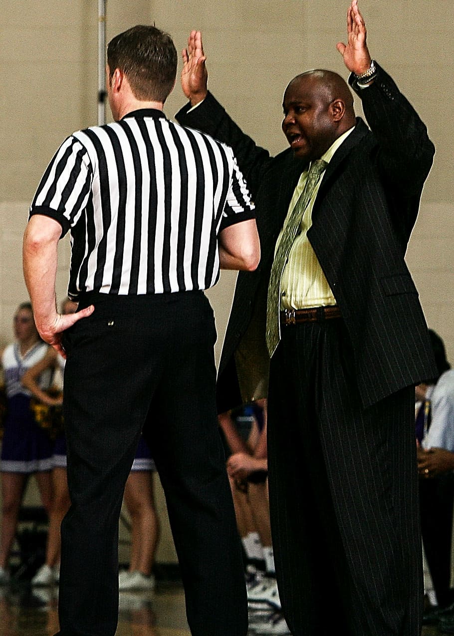 HD Wallpaper Man Wearing Black Suit Standing Near Referee