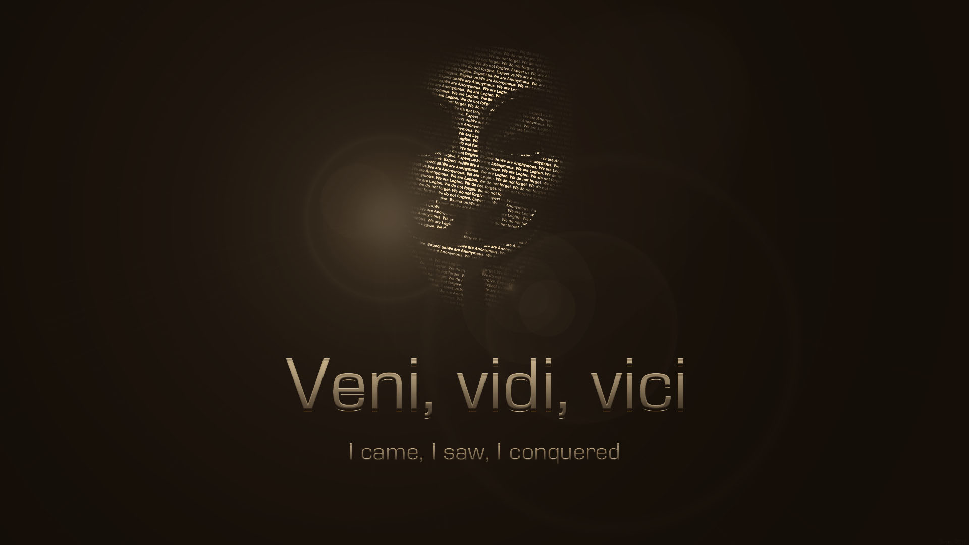 A stylized image of the Guy Fawkes mask, formed from small text, on a dark background.  Below the mask, the Latin phrase 'Veni, vidi, vici' and its English translation 'I came, I saw, I conquered' are displayed