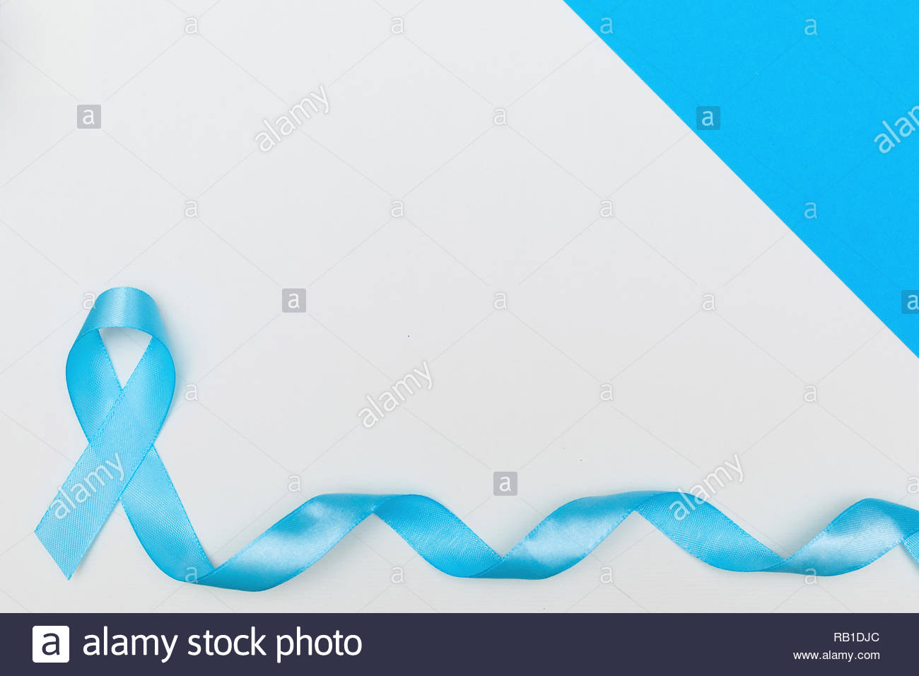 Blue Cancer Awareness Ribbon With Trail On White Background