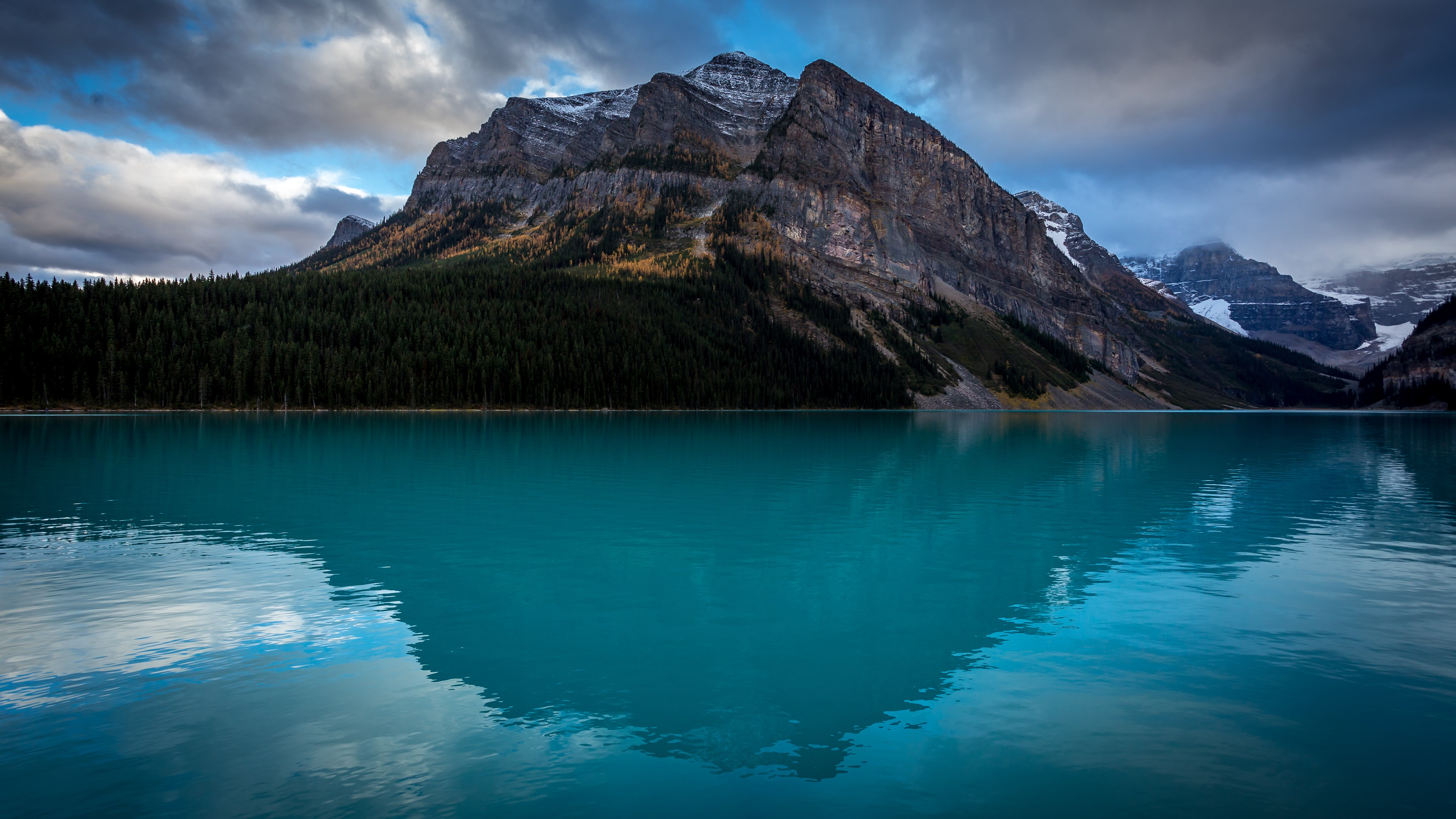 Stunning 4K wallpaper of a majestic mountain reflected in a turquoise lake